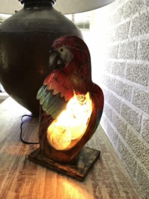 A metal lamp in the shape of a parrot, very beautiful!