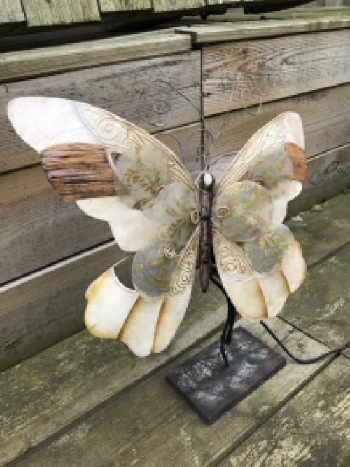 A metal lamp in the shape of a butterfly, very beautiful!