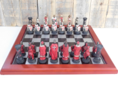 A chess game with the theme: ''MEDIEVAL KNIGHTS'', beautiful chess pieces like medieval knights on a wooden chessboard.