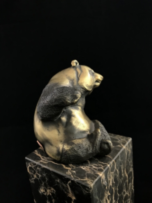 A bronze statue/sculpture of a sitting panda, on a beautiful large base!