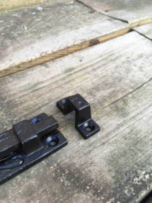 A beautiful door latch / slide lock, matte black, made of wrought iron