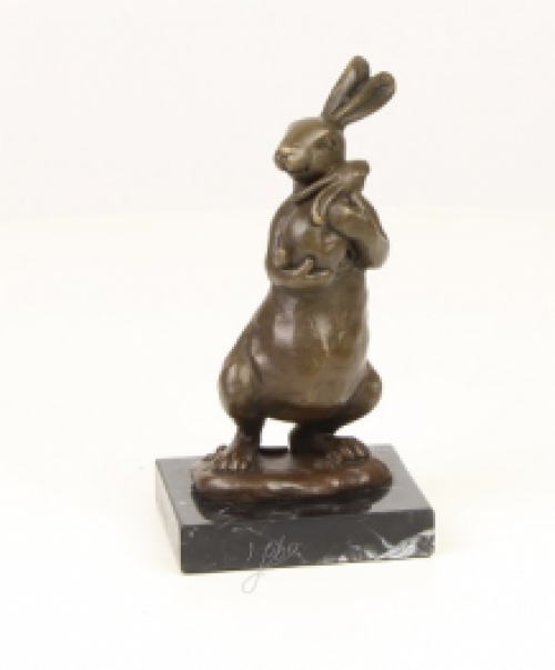 A bronze statue/sculpture of a rabbit with a cub