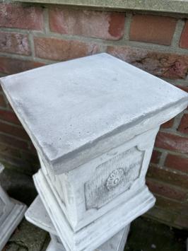 Pedestal pillar console made of solid cast stone.