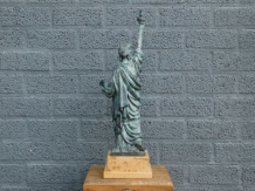 A bronze statue/sculpture of ''THE STATUE OF LIBERTY''