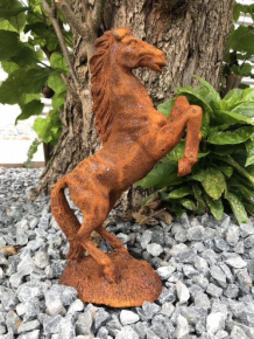 A beautiful statue of a rearing horse, cast iron rest