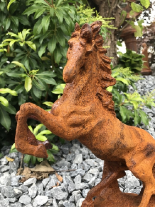 A beautiful statue of a rearing horse, cast iron rest