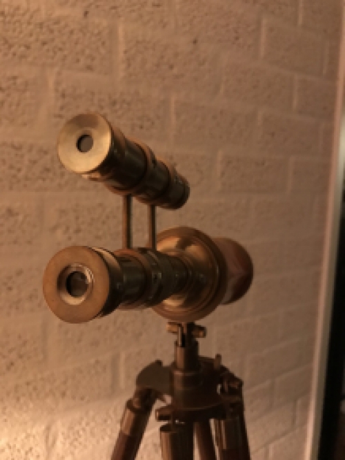 Beautiful decorative telescope on a wooden tripod