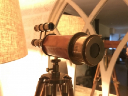 Beautiful decorative telescope on a wooden tripod