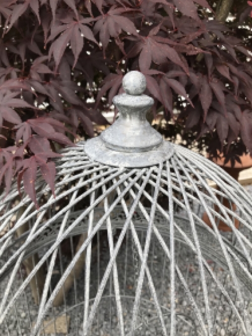 A very pretty decorative birdcage made of iron