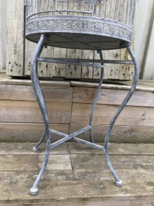 A very pretty decorative birdcage made of iron