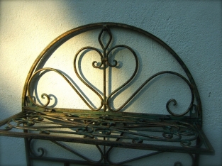 Wall shelf coat rack made of wrought iron