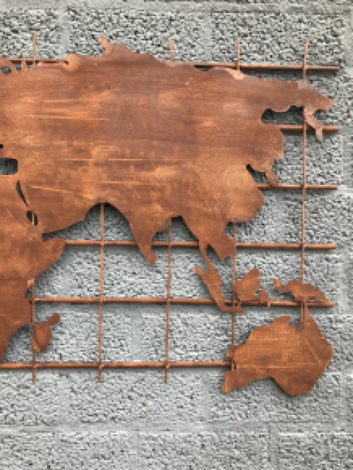 An iron wall rack with a world map on it, robust appearance